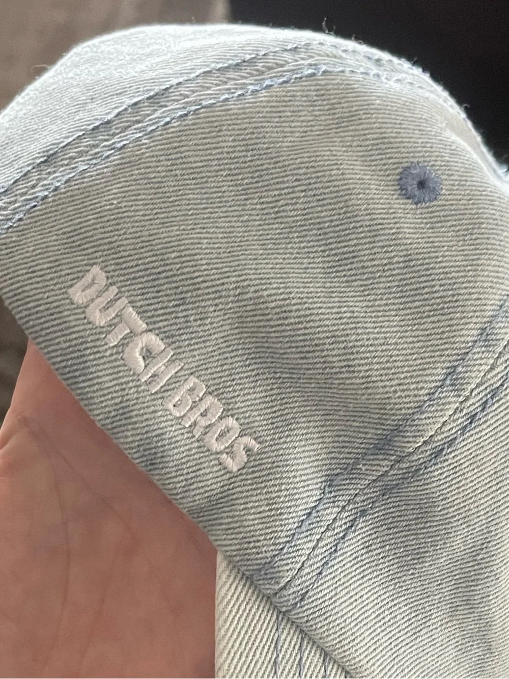Dutch Bros Light Blue Drip Smiley Baseball Cap